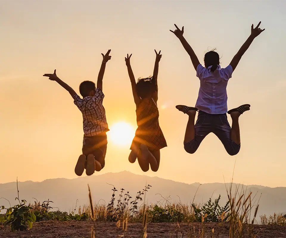 Three children jumping.